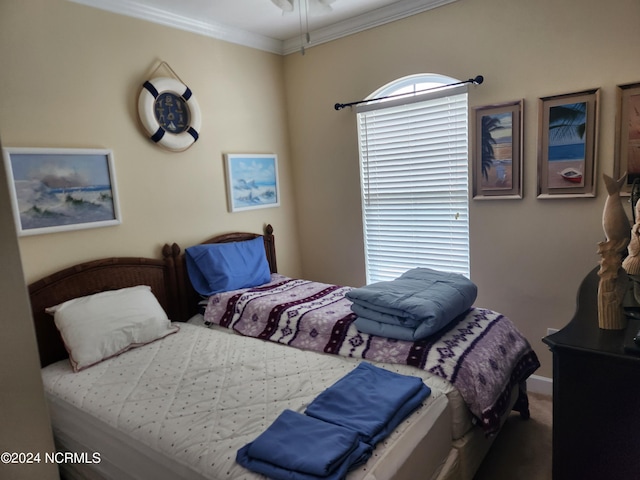 bedroom featuring ornamental molding and carpet flooring