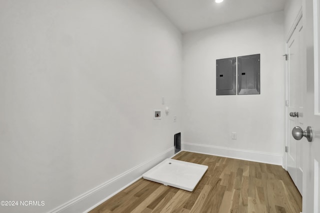 laundry room with washer hookup, laundry area, electric panel, and wood finished floors