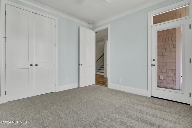 unfurnished bedroom featuring baseboards, a closet, and carpet floors