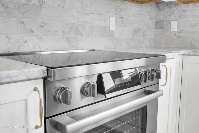 details with light stone countertops and stainless steel range