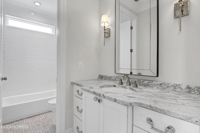 bathroom with toilet, vanity, and shower / bathing tub combination