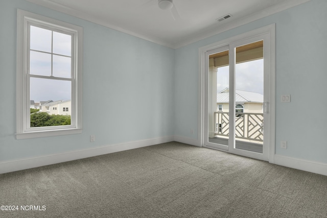 unfurnished room with visible vents, baseboards, carpet floors, and ornamental molding