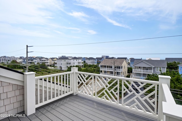 wooden deck featuring a residential view