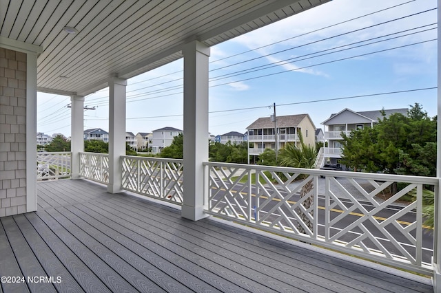 wooden terrace with a residential view