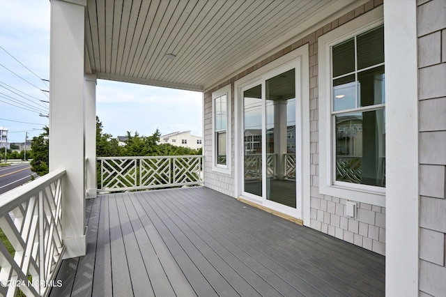 wooden terrace featuring a porch