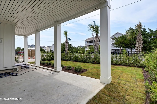 view of patio featuring fence