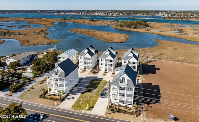 aerial view with a water view and a residential view