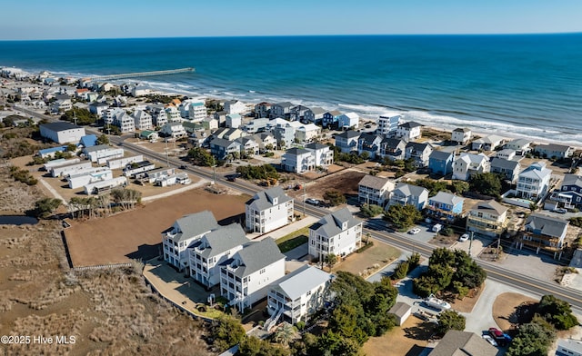 bird's eye view with a water view and a residential view