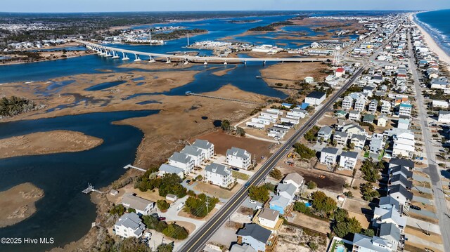 birds eye view of property featuring a water view and a view of the beach