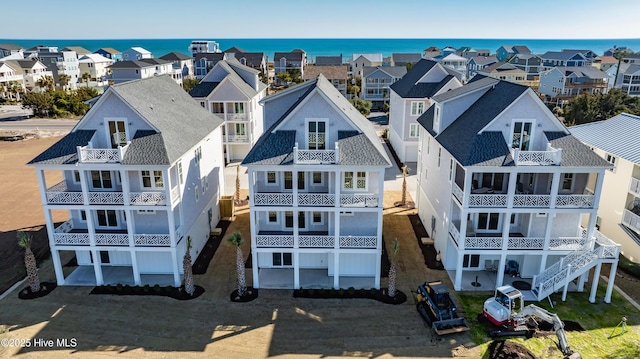 aerial view with a residential view and a water view