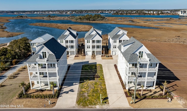 bird's eye view featuring a residential view and a water view