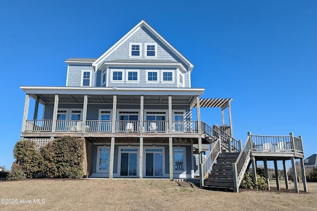 view of front of property with stairway and a wooden deck