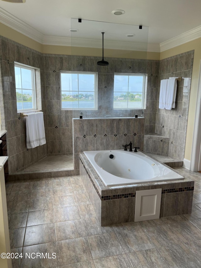 bathroom featuring a walk in shower, a jetted tub, tile walls, and crown molding