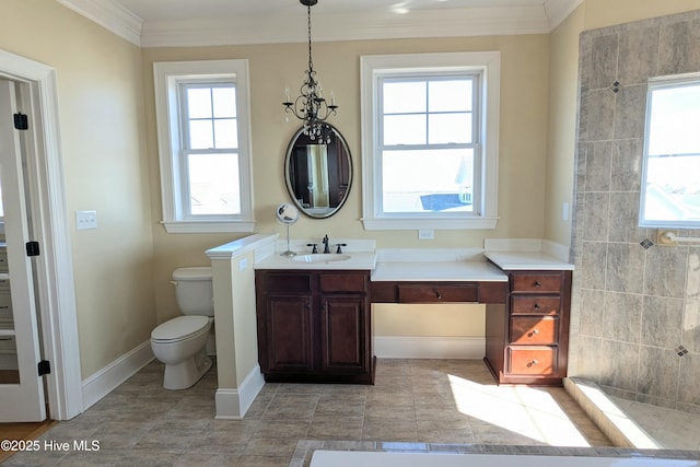 bathroom featuring ornamental molding, baseboards, vanity, and toilet