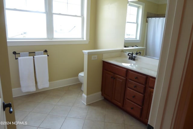 full bath with toilet, vanity, baseboards, tile patterned floors, and radiator heating unit