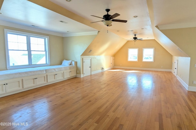 bonus room featuring vaulted ceiling, light wood-type flooring, visible vents, and baseboards