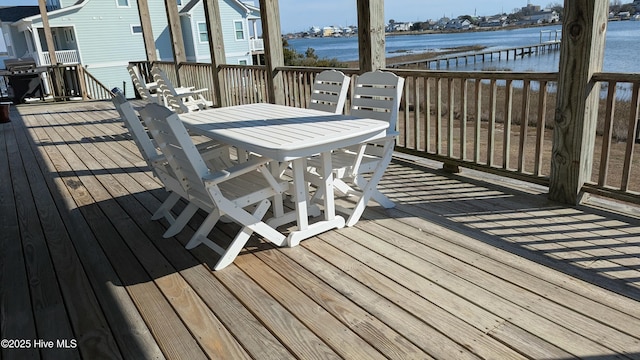 wooden terrace with a water view