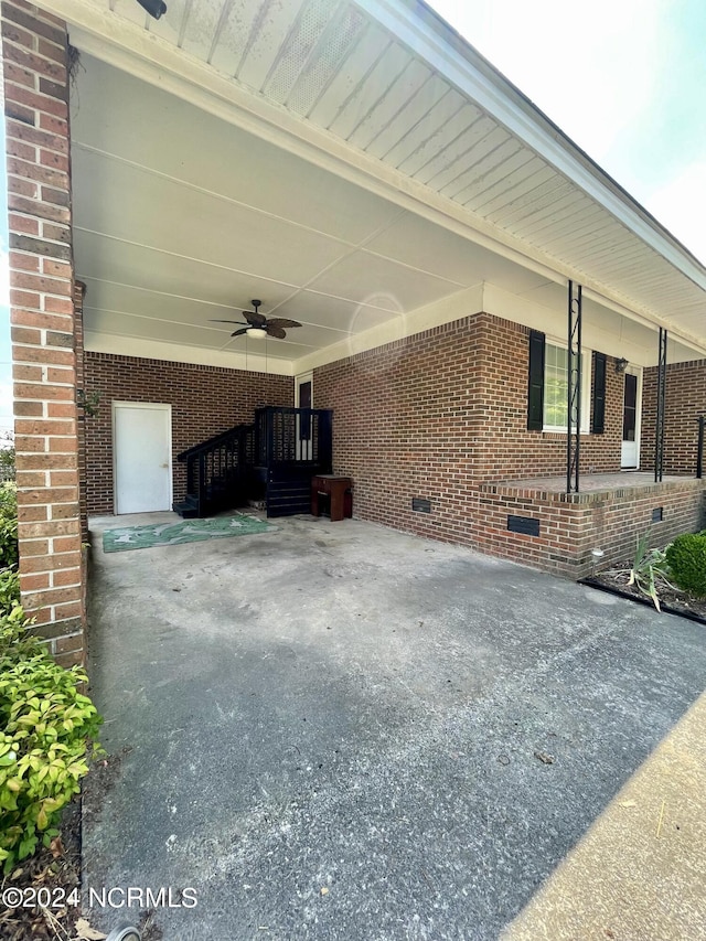 view of patio with driveway and an attached carport