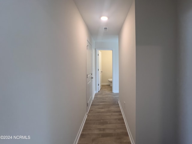 hallway featuring dark wood-type flooring