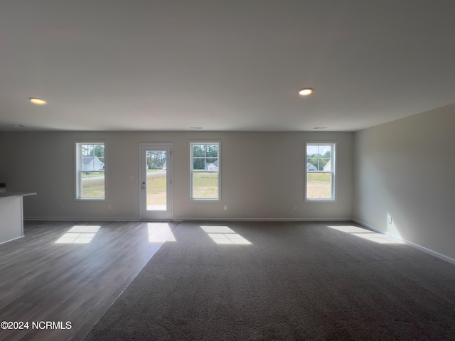 spare room featuring dark wood-type flooring