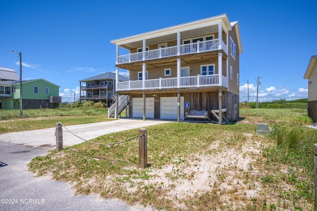 view of front of house with a garage and a balcony