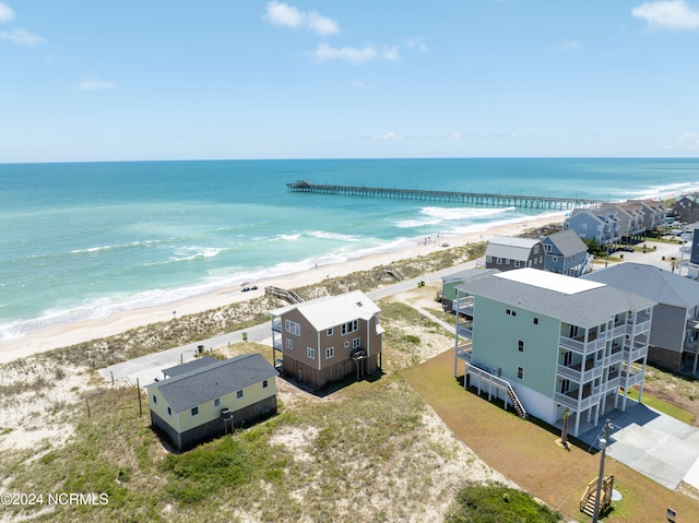 birds eye view of property featuring a water view and a view of the beach