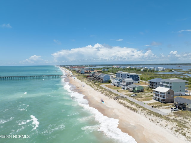 bird's eye view with a beach view and a water view