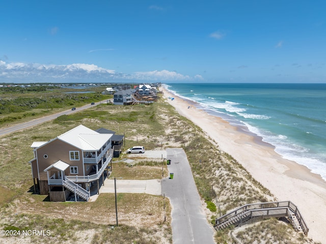 aerial view featuring a water view and a view of the beach