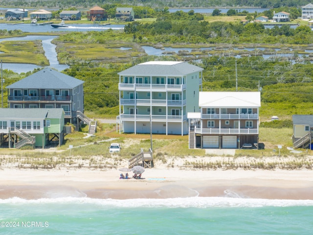 drone / aerial view with a view of the beach and a water view