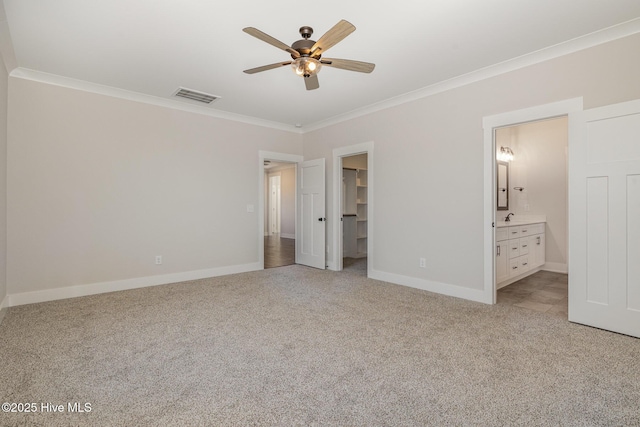198 Ruskin Dr, Smithfield, NC 27577 - unfurnished bedroom with ornamental molding, light carpet, a spacious closet, and a closet