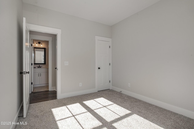 198 Ruskin Dr, Smithfield, NC 27577 - unfurnished bedroom with sink and carpet floors