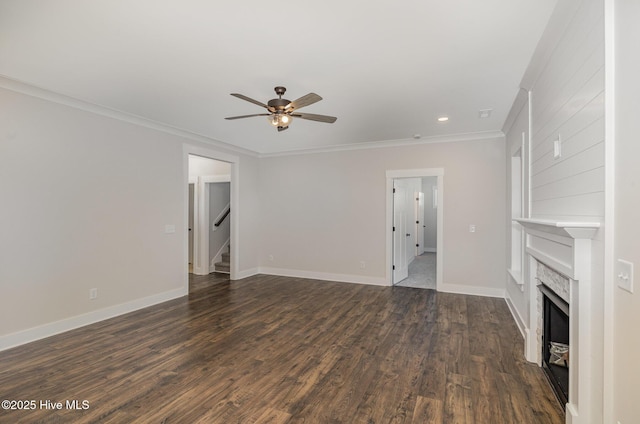 unfurnished living room with a fireplace, ceiling fan, dark hardwood / wood-style flooring, and ornamental molding