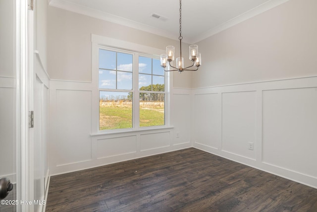 unfurnished dining area with a chandelier, dark hardwood / wood-style floors, and ornamental molding