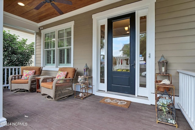 view of exterior entry featuring ceiling fan