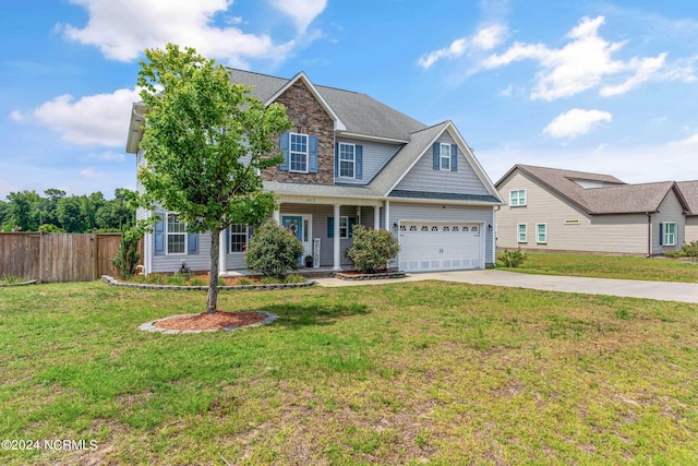 craftsman-style house featuring a front yard and a garage