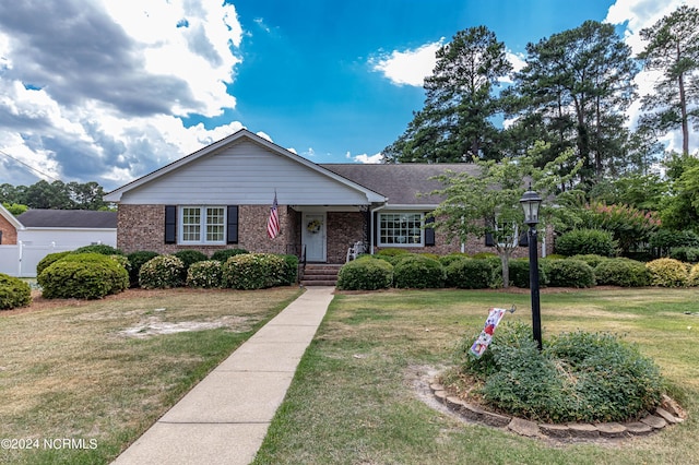 single story home featuring a front yard