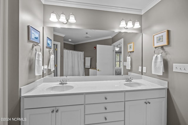 bathroom with ornamental molding and vanity