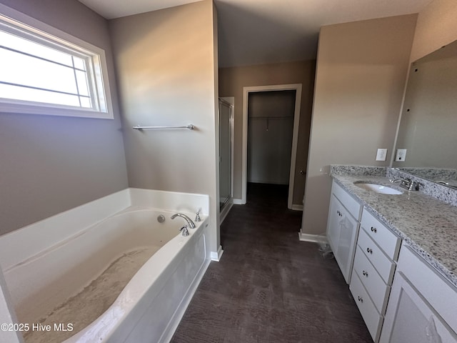 bathroom with plus walk in shower and vanity