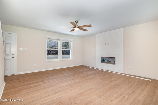 bathroom featuring hardwood / wood-style flooring, vanity, and plus walk in shower