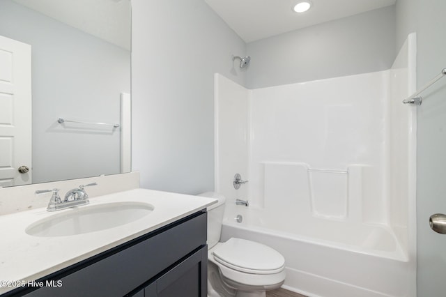 full bathroom featuring vanity, shower / bathtub combination, and toilet