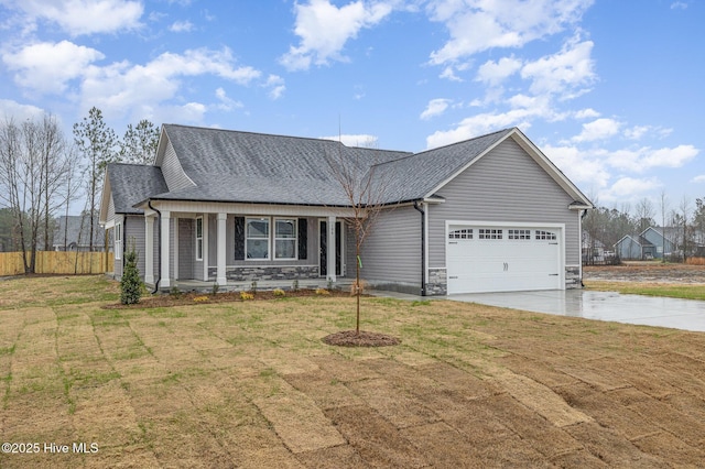 ranch-style home with a garage, covered porch, and a front yard