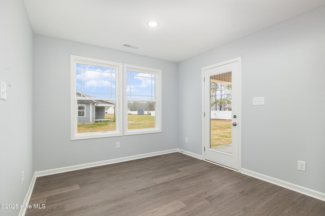 empty room with dark wood-type flooring