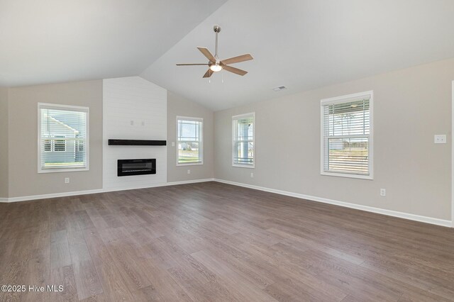 carpeted empty room with ceiling fan and a tray ceiling