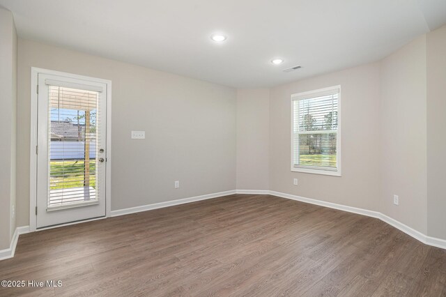 full bathroom with hardwood / wood-style flooring, toilet, vanity, and independent shower and bath