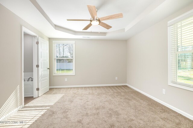 spare room featuring dark colored carpet