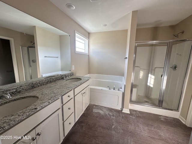 bathroom with plus walk in shower and vanity