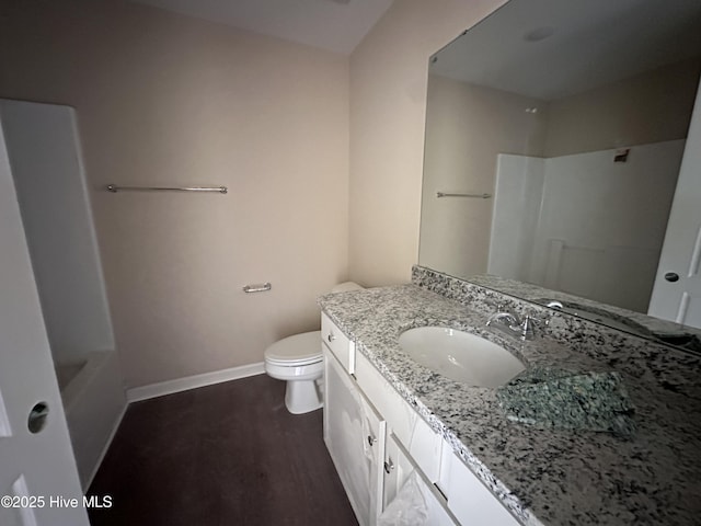 bathroom with a shower, wood-type flooring, toilet, and vanity