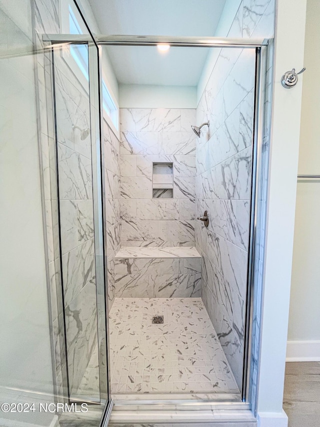 bathroom featuring an enclosed shower