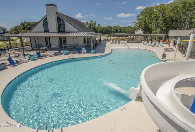 view of swimming pool with a patio area