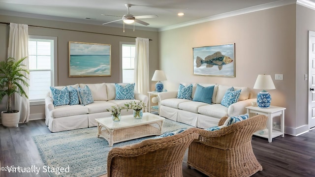 living room featuring a healthy amount of sunlight, ceiling fan, ornamental molding, and dark hardwood / wood-style floors